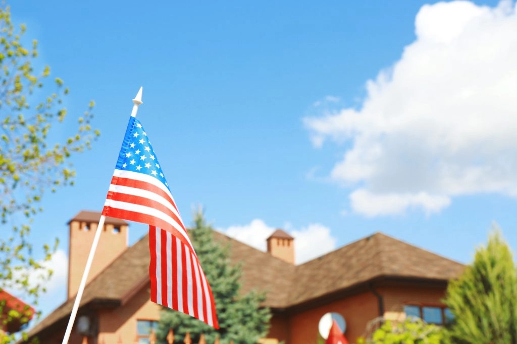 roofs for troops flag waving in front of beautiful home with roof