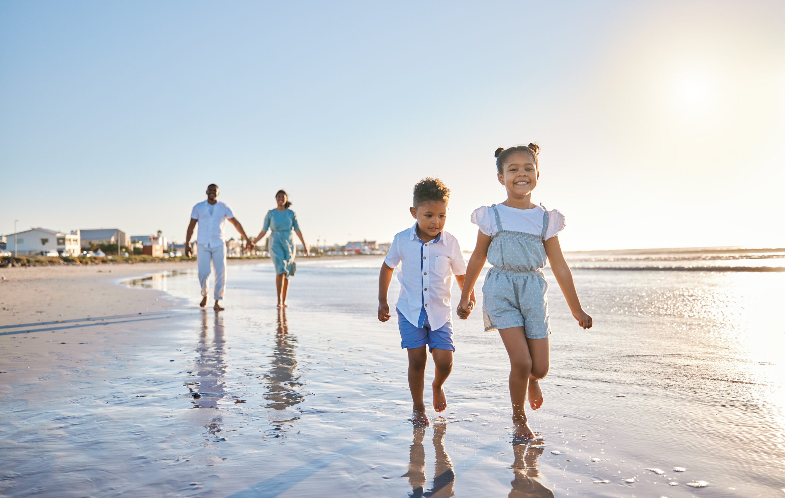 family walking on beach little river sc