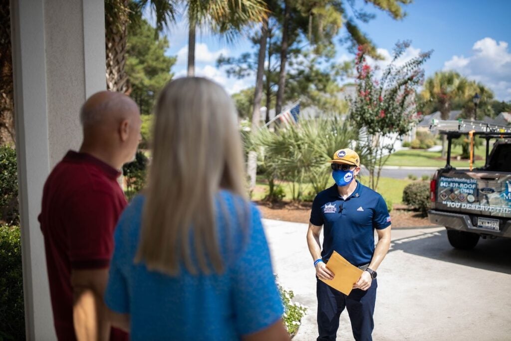 Monarch team member and homeowners discussing project