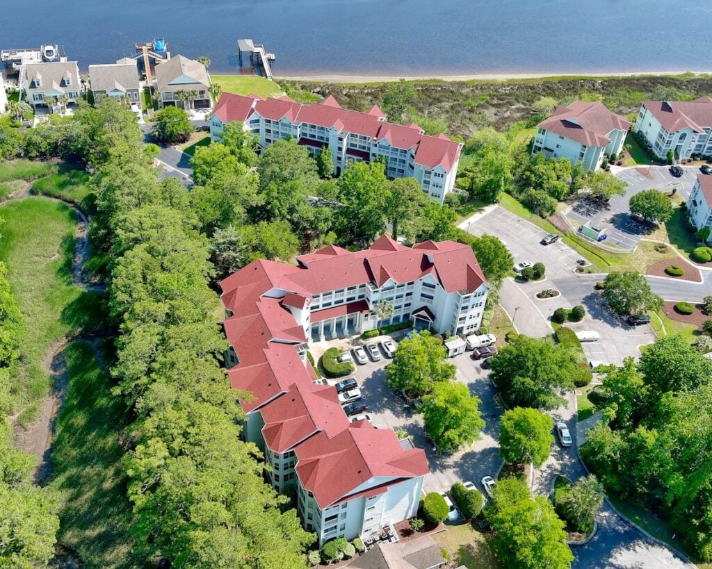 Aerial view of a living community with red roofs on buildings