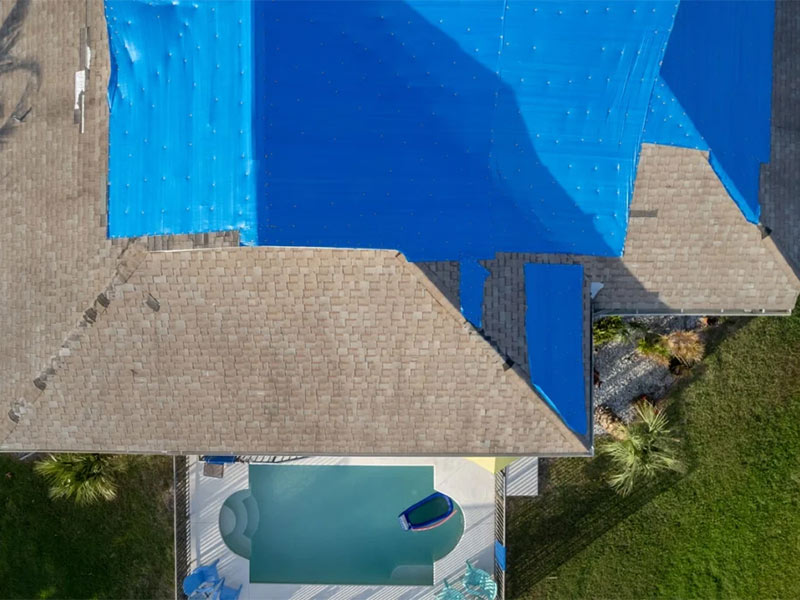 How to position a tarp on a roof for coverage