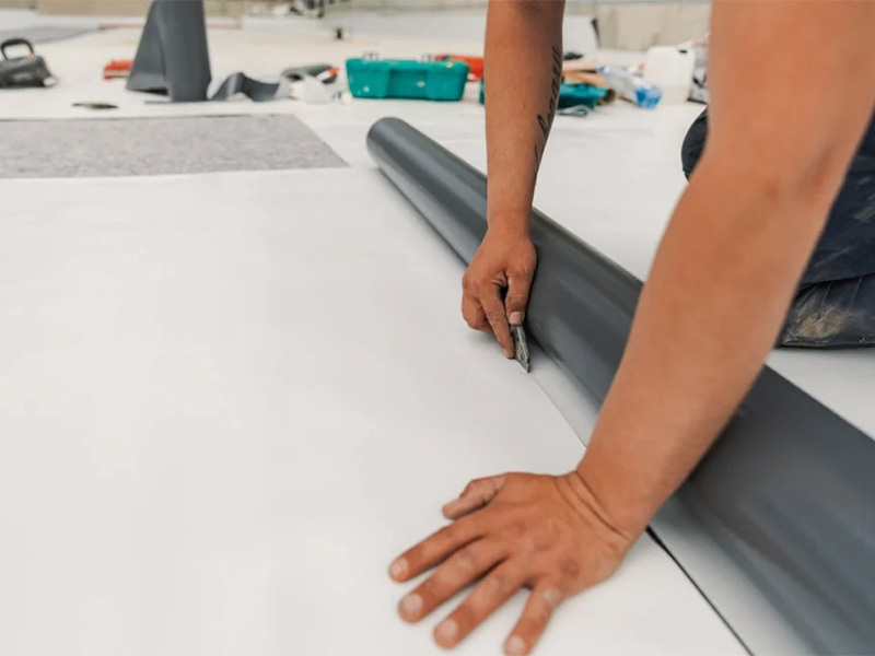 TPO roofing membrane being installed on a flat roof.