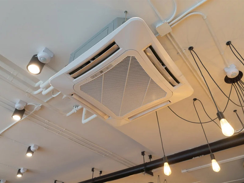 White ceiling-mounted ventilation unit indoors.