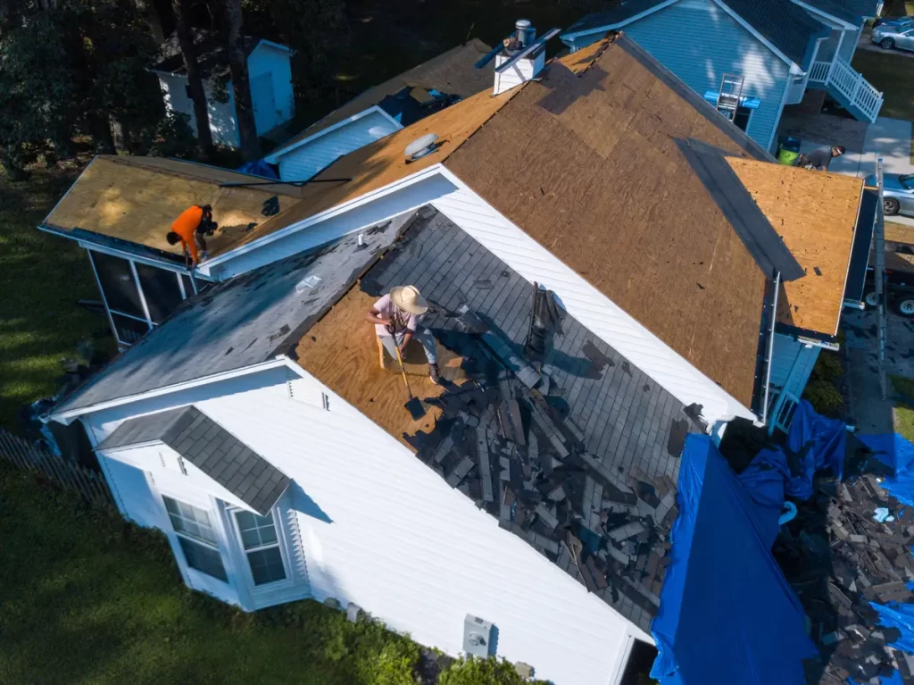 a roof replacement 2 workers