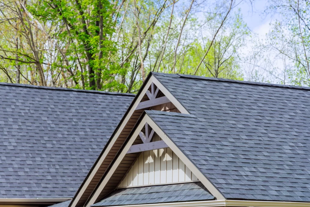 shingle roofing system with ridge cap shingles and design along gable point