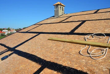 close up image of a sloped roof with sheathing