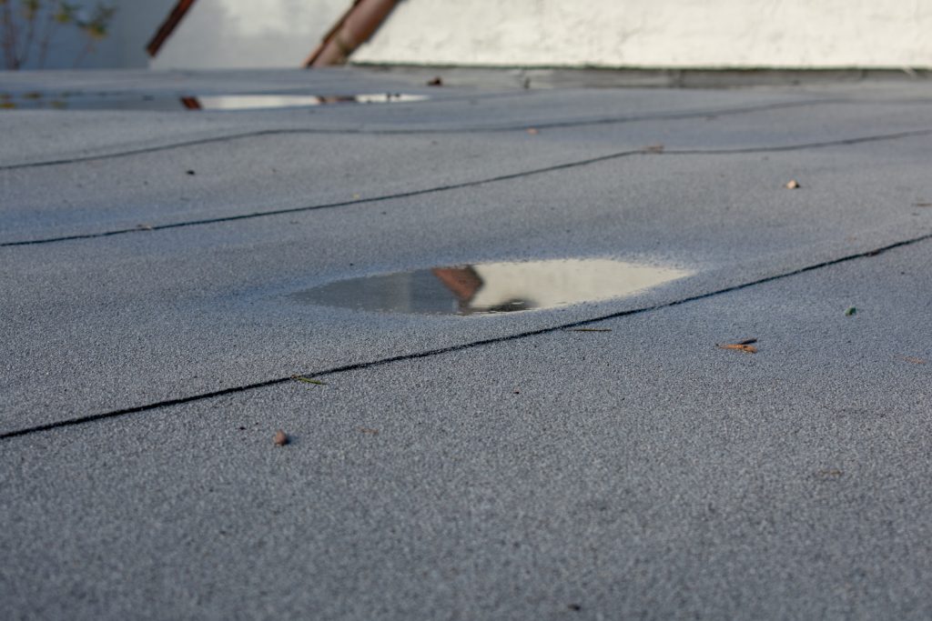 commercial roof inspection dealing with roof sagging