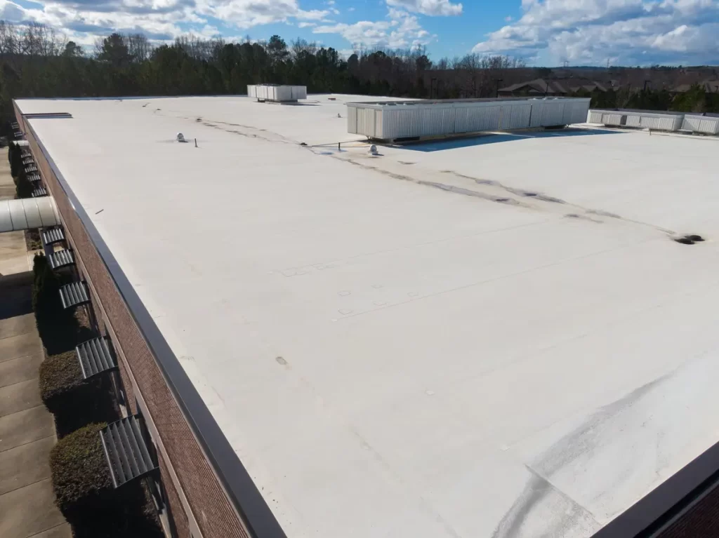 commercial roof system with stains