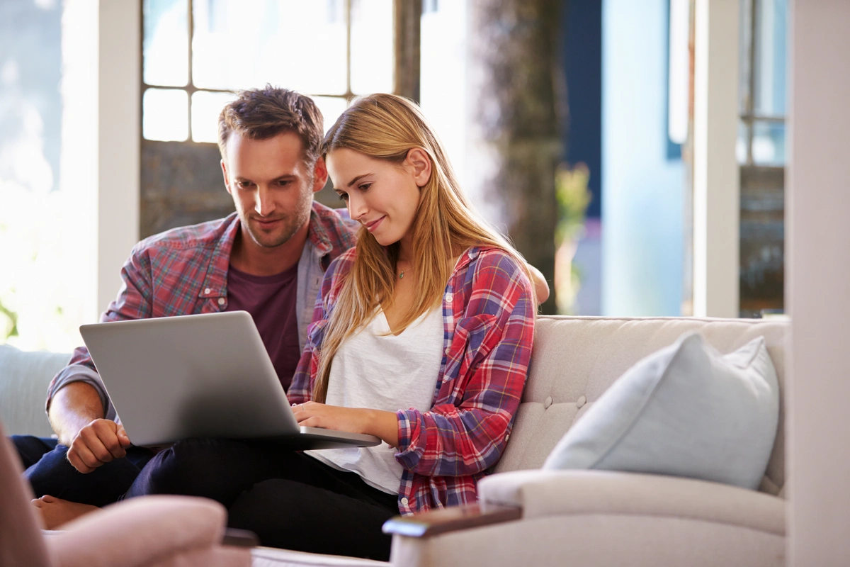 young couple chooses best roofing contractor for replacement