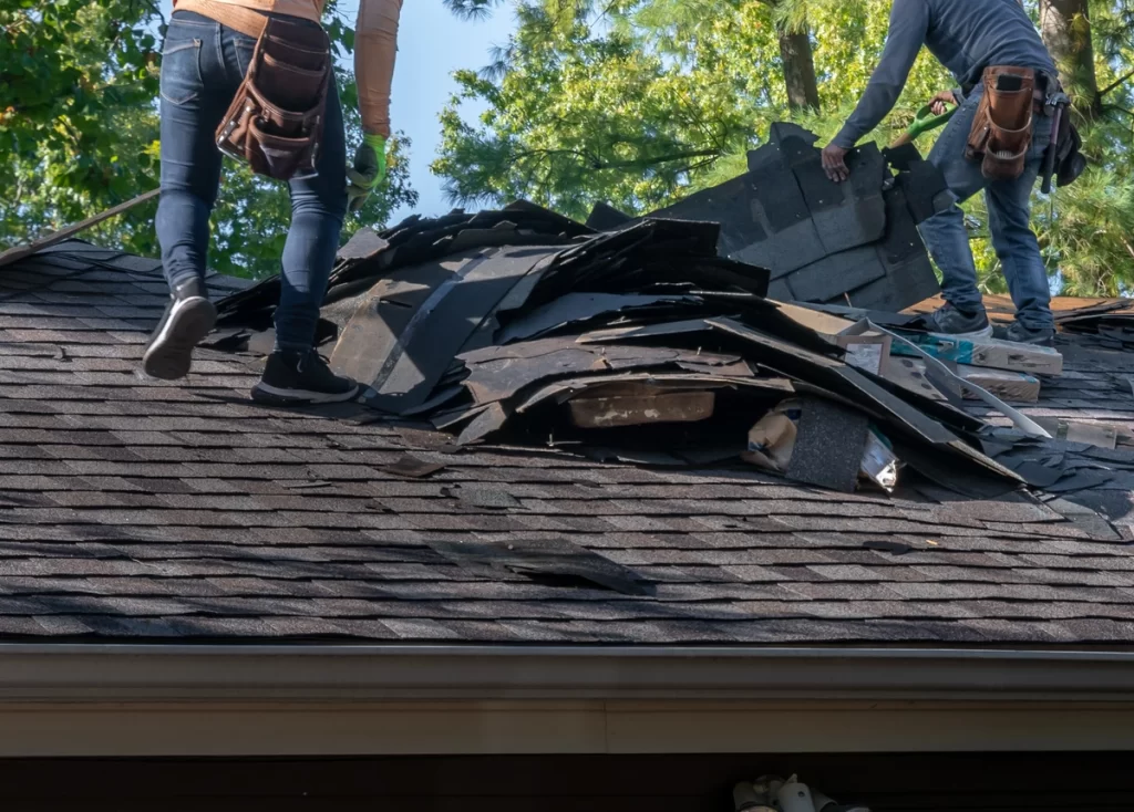 contractors perform roof installation using tools