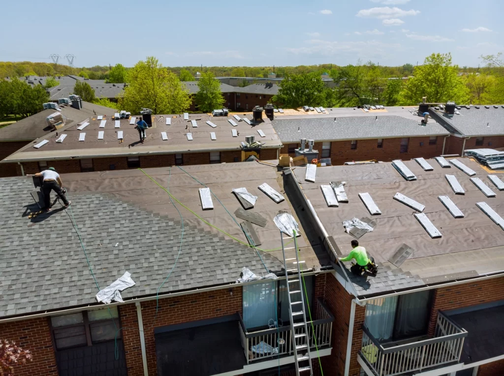 aerial view of roof replacement being installed on large roofs
