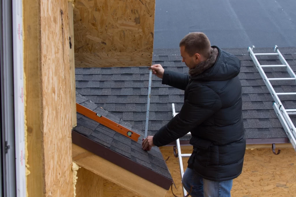 roofer measuring shingle roof