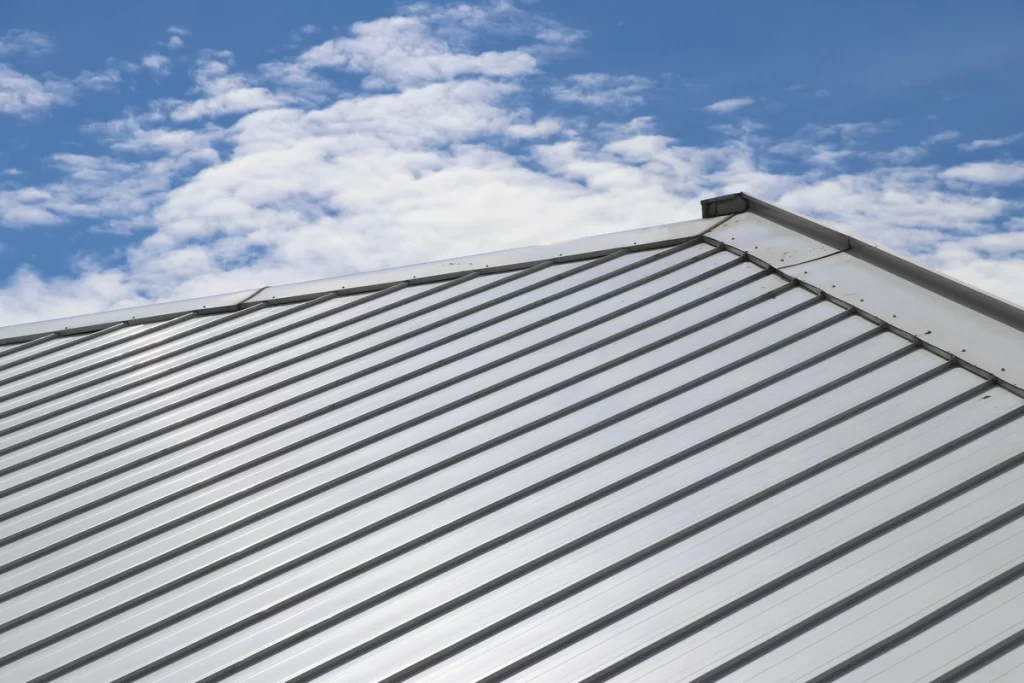 close up of a standing seam metal roof under sky