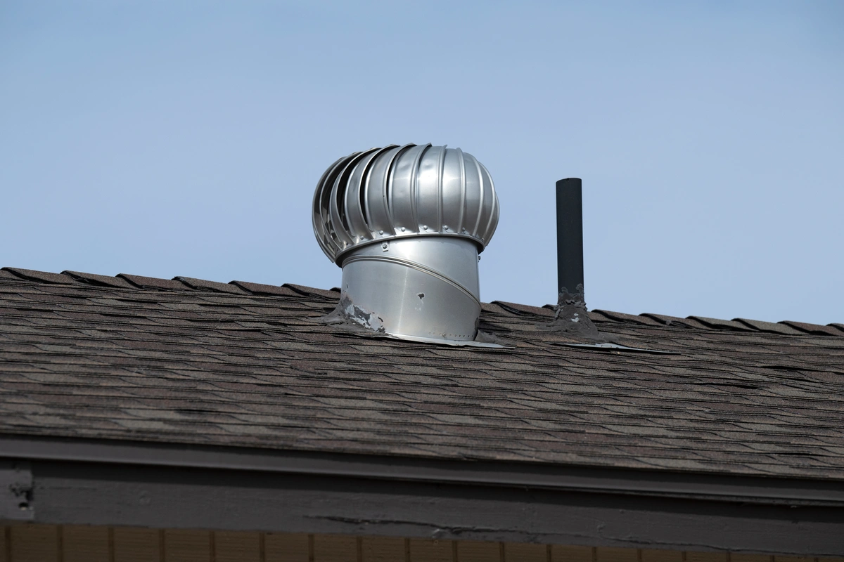 metal roof ventilation system on asphalt roof