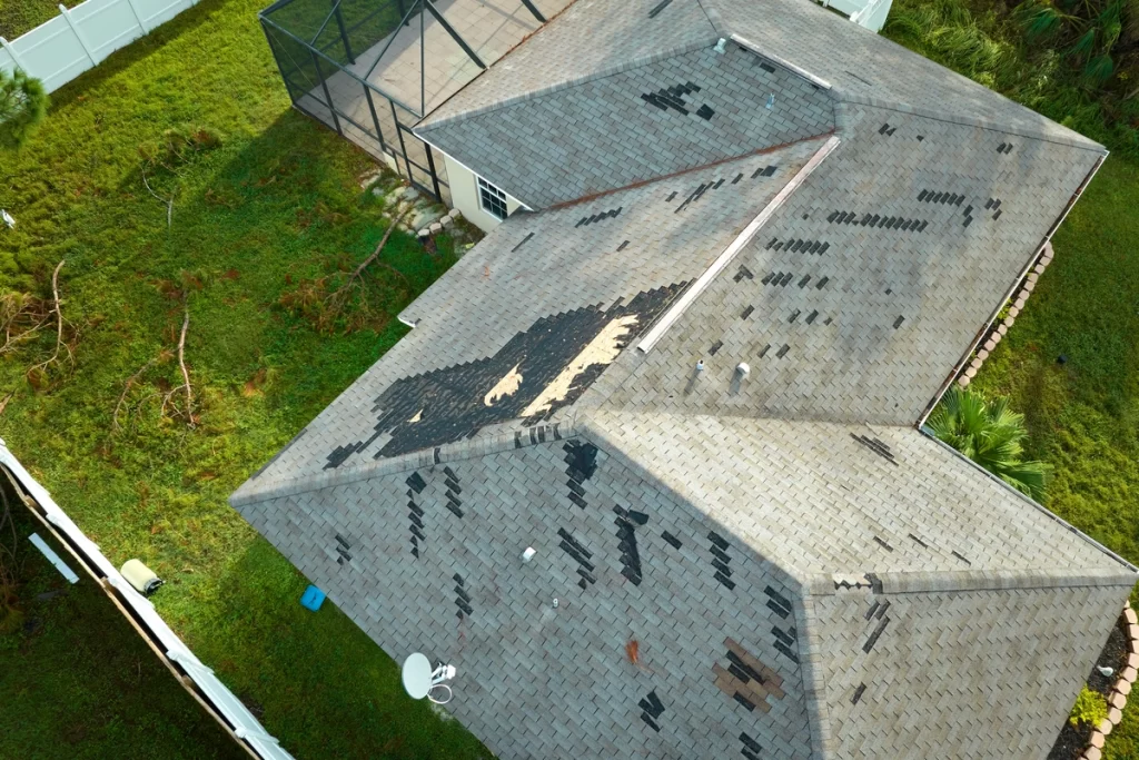 aerial view of roof in need of tarp after storm damage