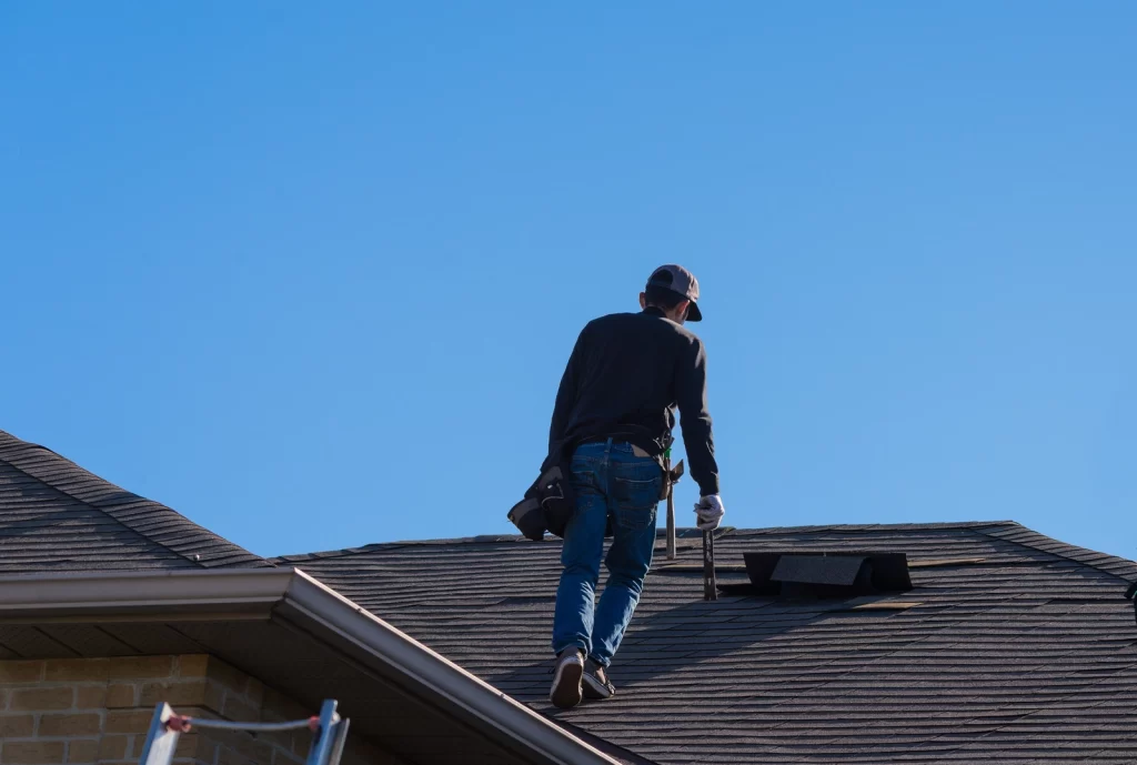 Roofer performs roof inspection to get insurance coverage for roof replacement
