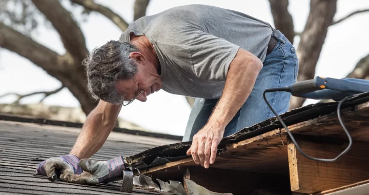 man conducting roof repairs