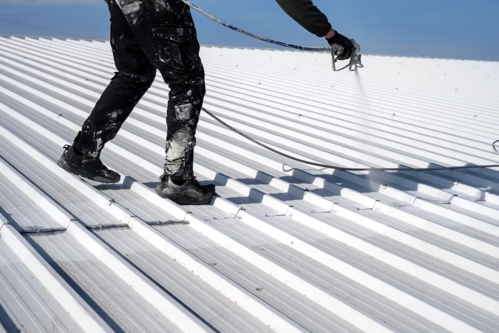 worker on a metal roof