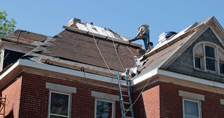 worker completing roof replacement timeline